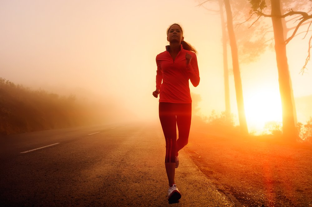 runner woman early morning sunrise