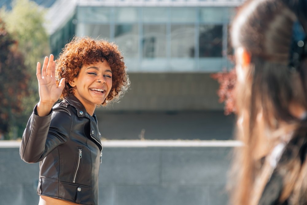 women greeting each other
