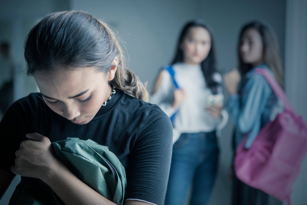 girl bullied with her friends