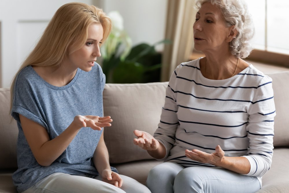 woman lecturing adult child