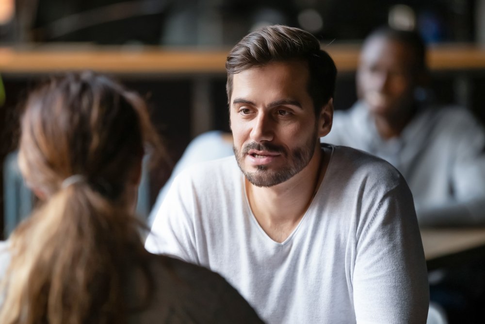 man having conversation with woman