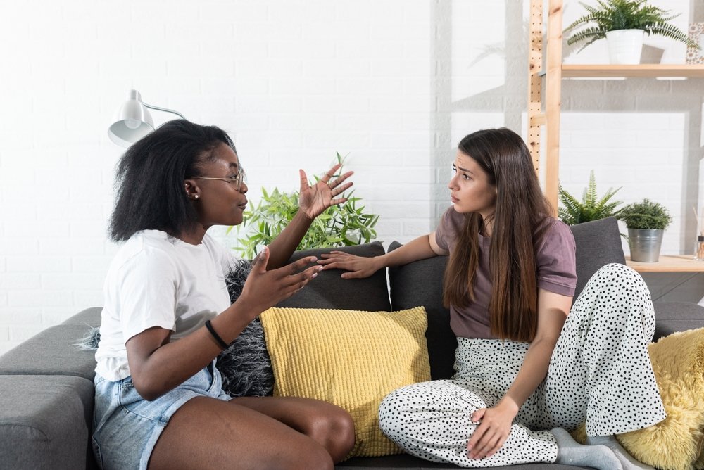 women argue in their home