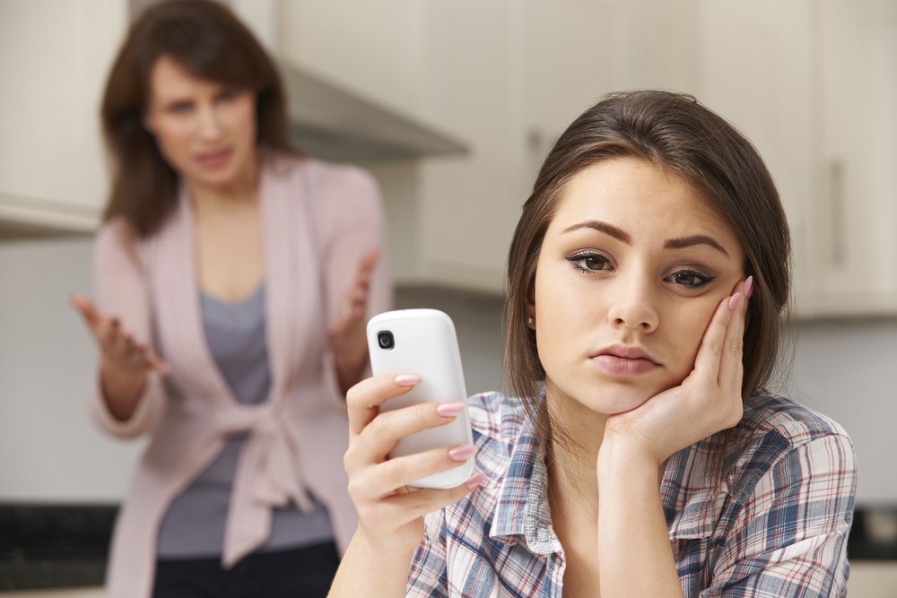Mother Arguing With Daughter Over Use Of mobile Phone