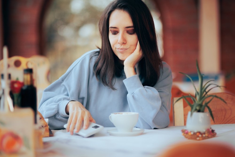 Woman Bothered by her Phone Ringing
