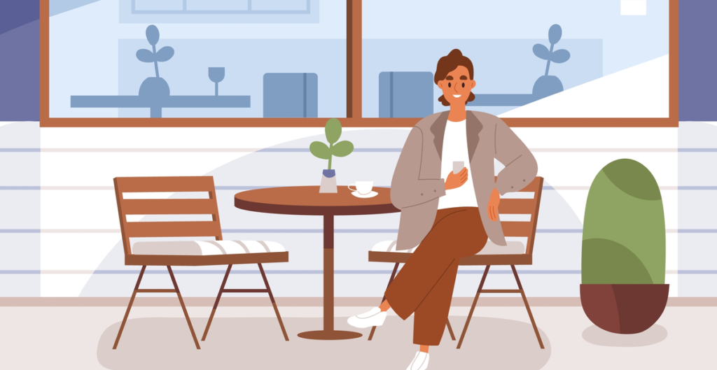 Woman sitting at cafe table