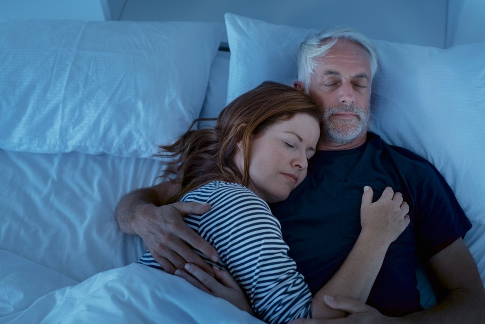 couple resting in their bed
