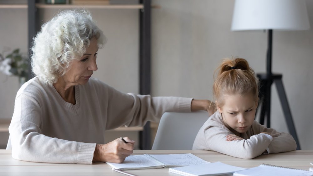 grandmother and kid doing homework