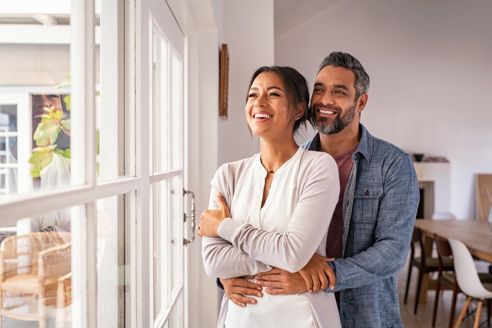 mid adult couple hugging